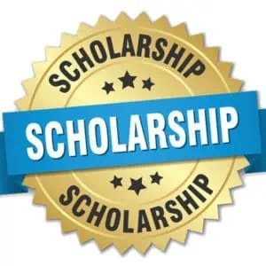 A gold badge with the word SCHOLARSHIP written three times and a blue ribbon across the center displaying SCHOLARSHIP in bold white letters.